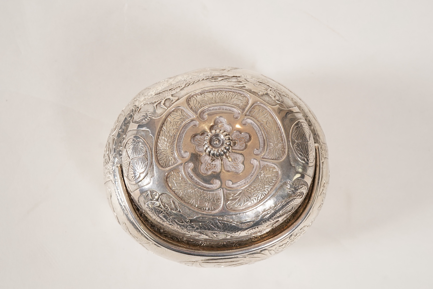 A Japanese Meiji period white metal tea caddy and cover with fluted knop, signed